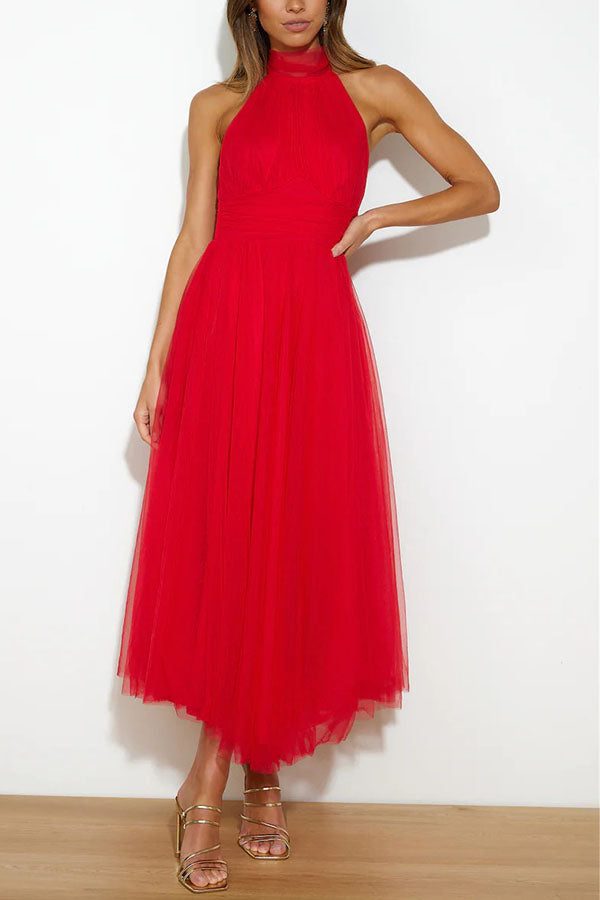 Beautiful women's halterneck maxi dress, an elegant wedding guest gown or formal party dress.
