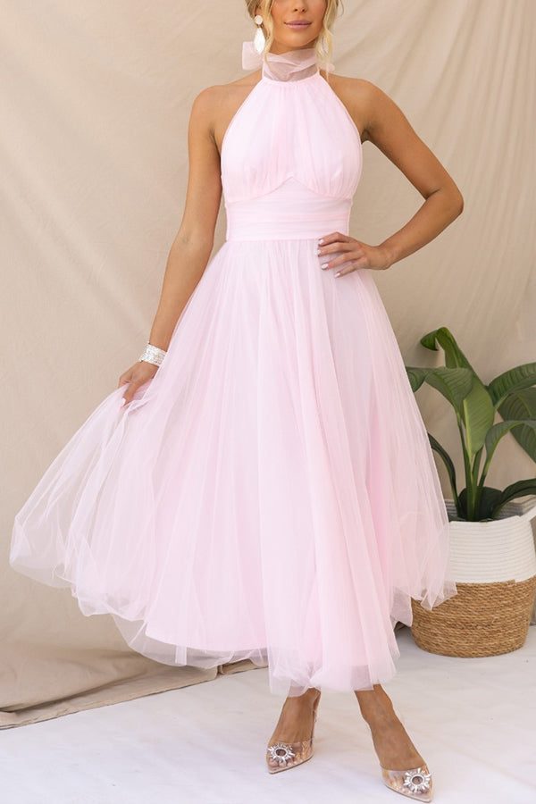 Flowy A-line halterneck maxi dress for women. Elegant & comfortable for special occasion events.
