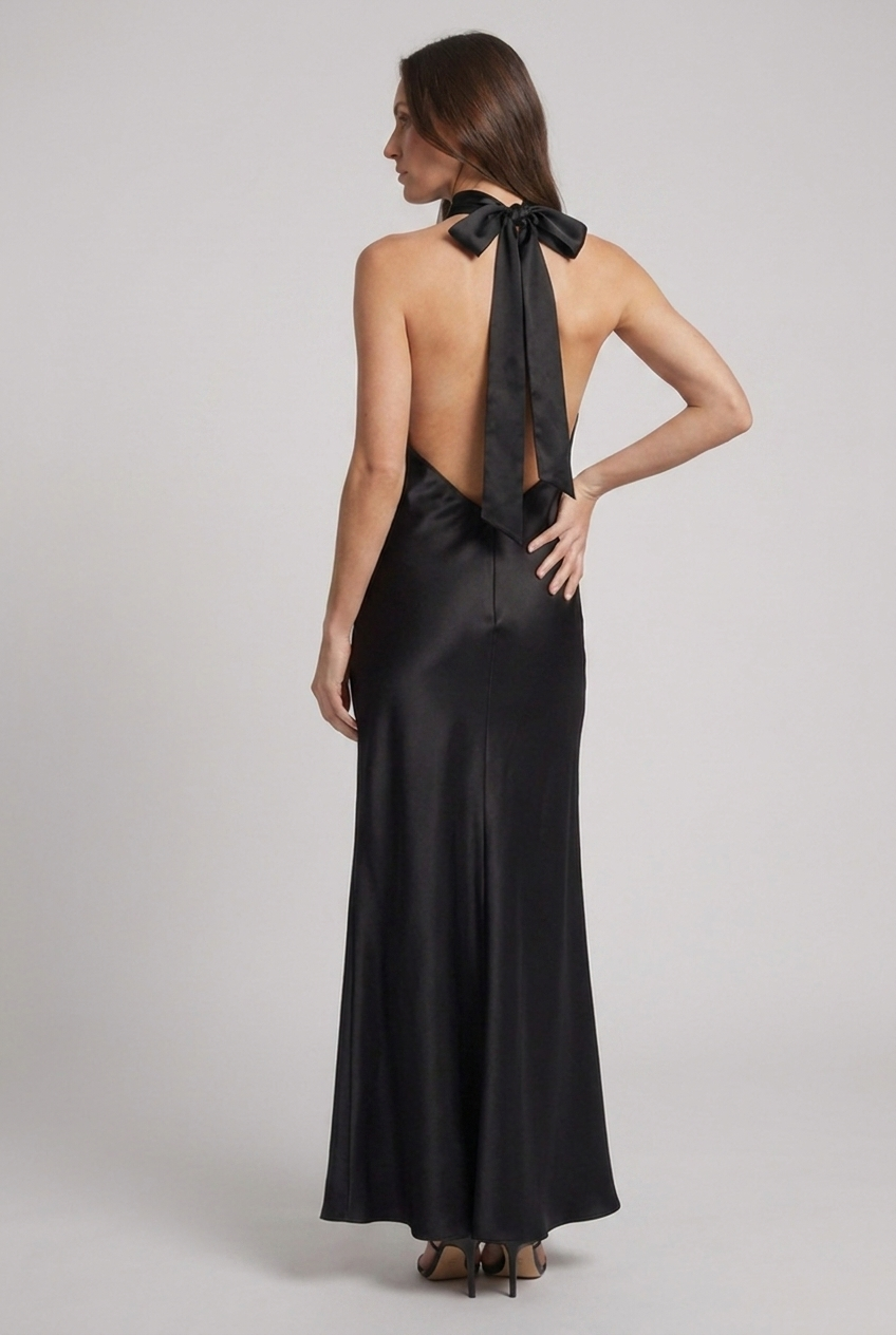 Luxurious women's halterneck maxi dress, a stunning wedding guest or black-tie option for elegant events.