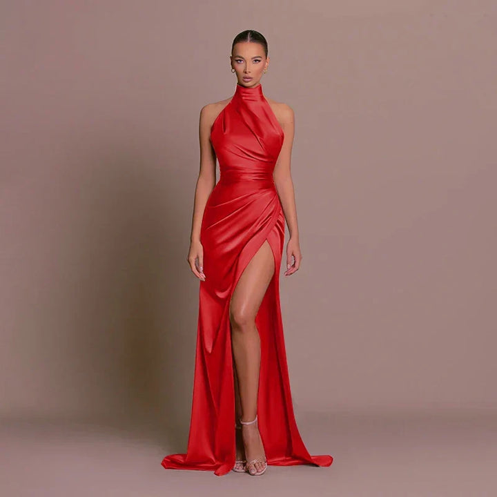 Luxurious women's halterneck evening maxi dress with a dramatic high split, ideal for formal parties.