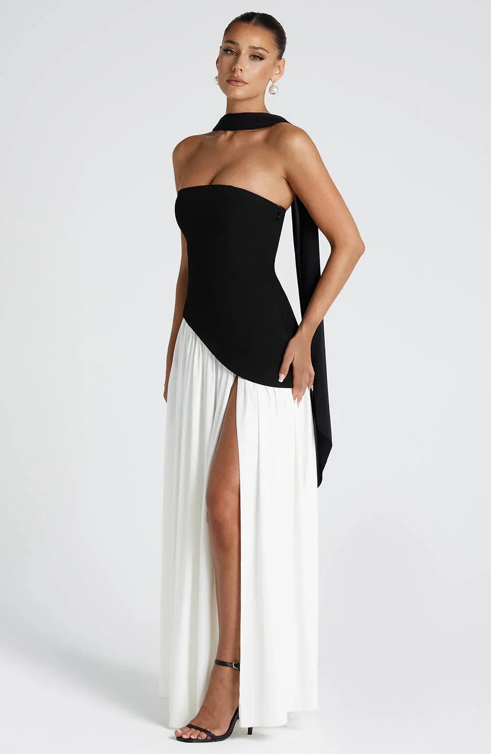 Elegant halterneck maxi dress with high split, perfect for wedding guests or evening parties.