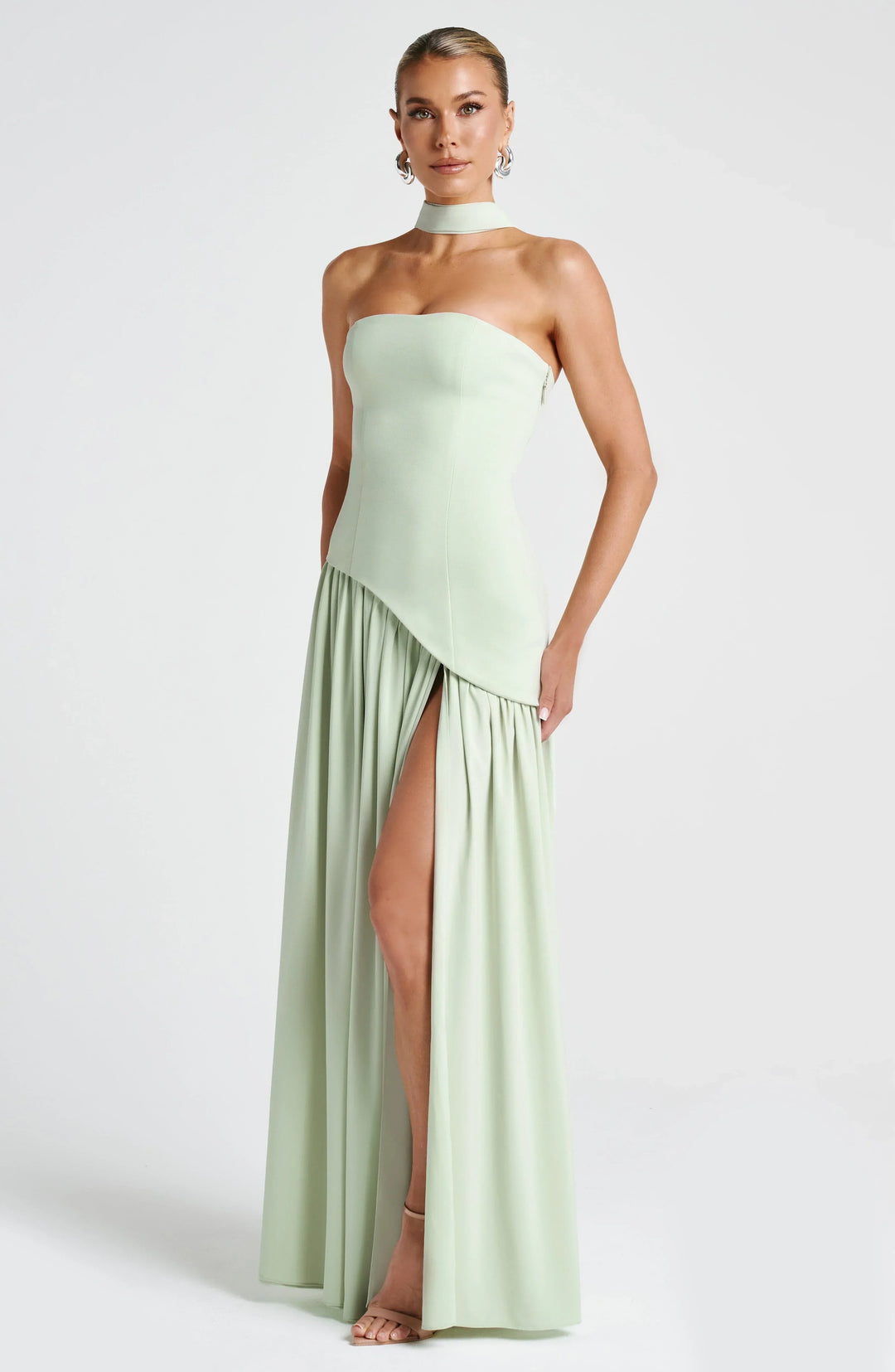 Versatile halterneck maxi dress with high split, suitable for various formal & special occasions.