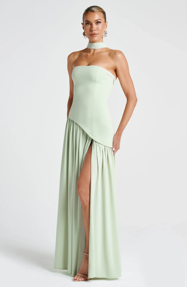 Versatile halterneck maxi dress with high split, suitable for various formal & special occasions.