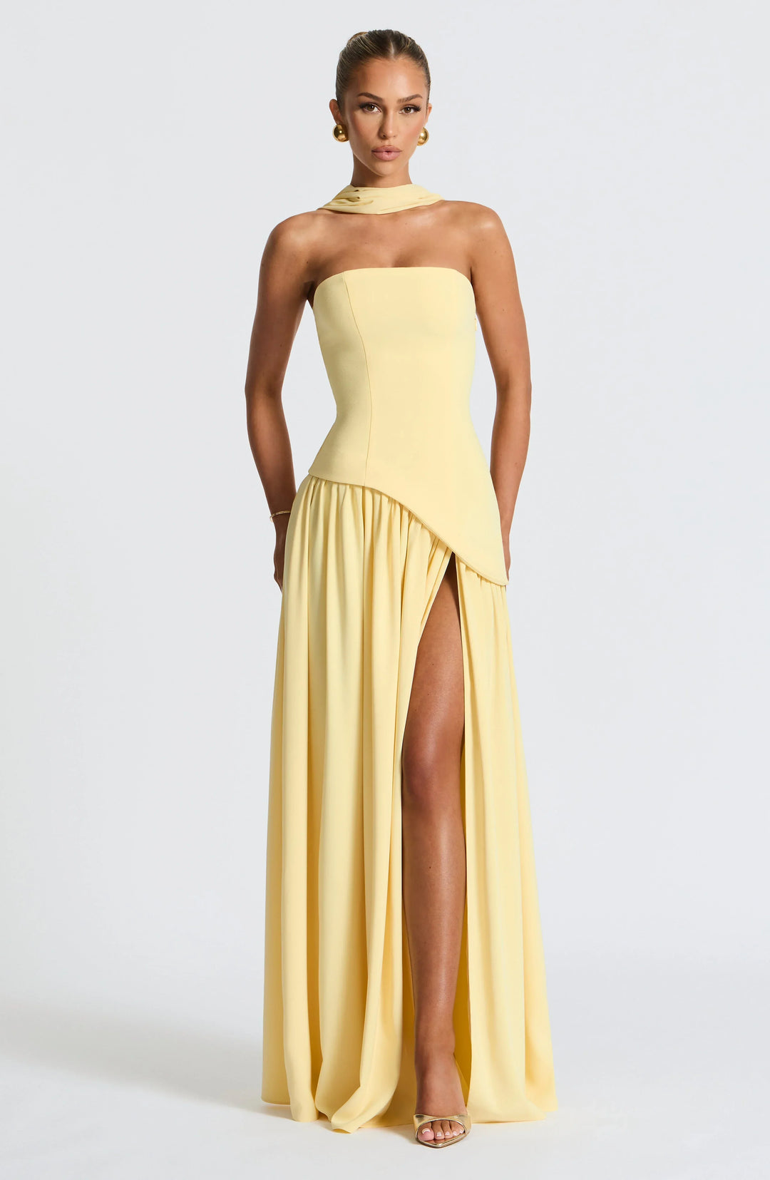 Fashionable halterneck party maxi dress with high split, ideal for special occasions & dinners.