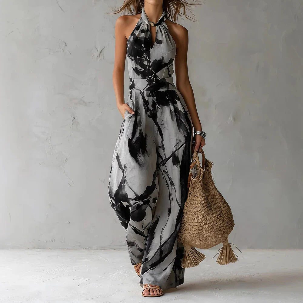 Elegant women's halterneck wide leg jumpsuit. Flowing and comfortable, perfect for summer parties or resort wear.