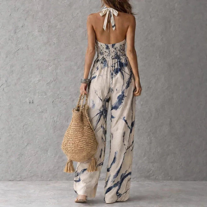Chic women's halterneck wide leg jumpsuit. Versatile for casual summer days, elegant parties, or resort vacations.