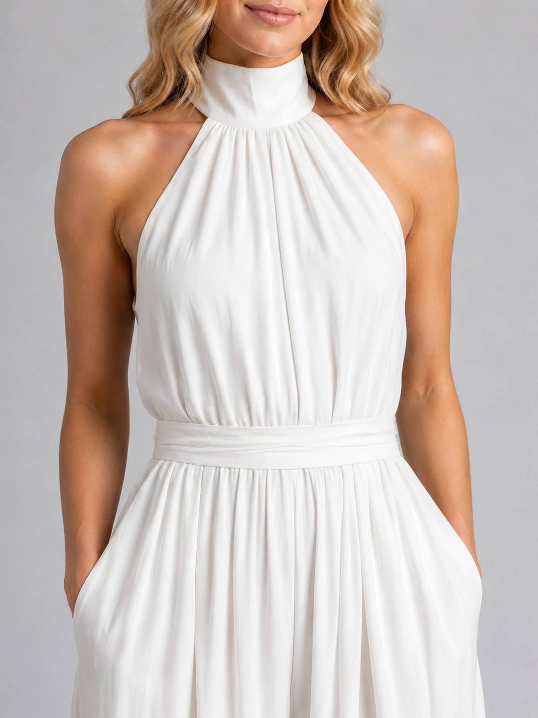 Versatile women's halterneck wide-leg jumpsuit, ideal for casual or formal wear. Features a flattering silhouette.