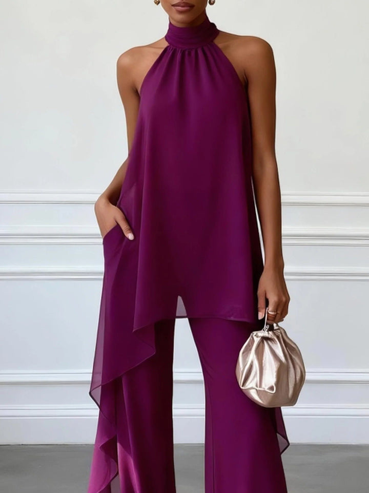 Fashionable women's halterneck wide leg pant set, a modern jumpsuit alternative for elegant occasions.
