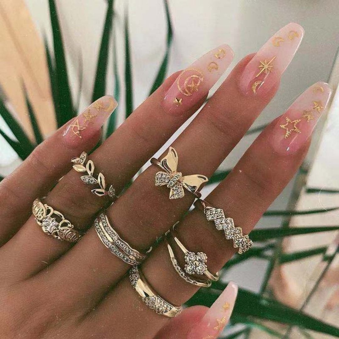 Handmade silver ring set displayed, elegant stackable women's jewelry, showcasing unique boho design.