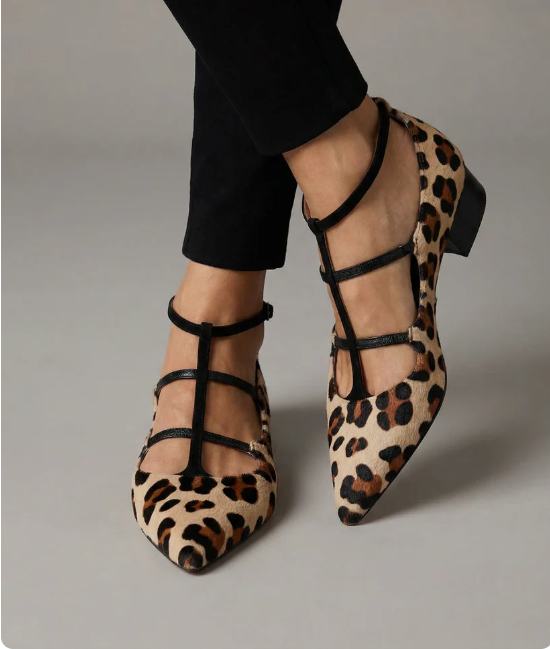 Chic women's high heels featuring a distinctive leopard strap, ideal for versatile elegant fashion looks.