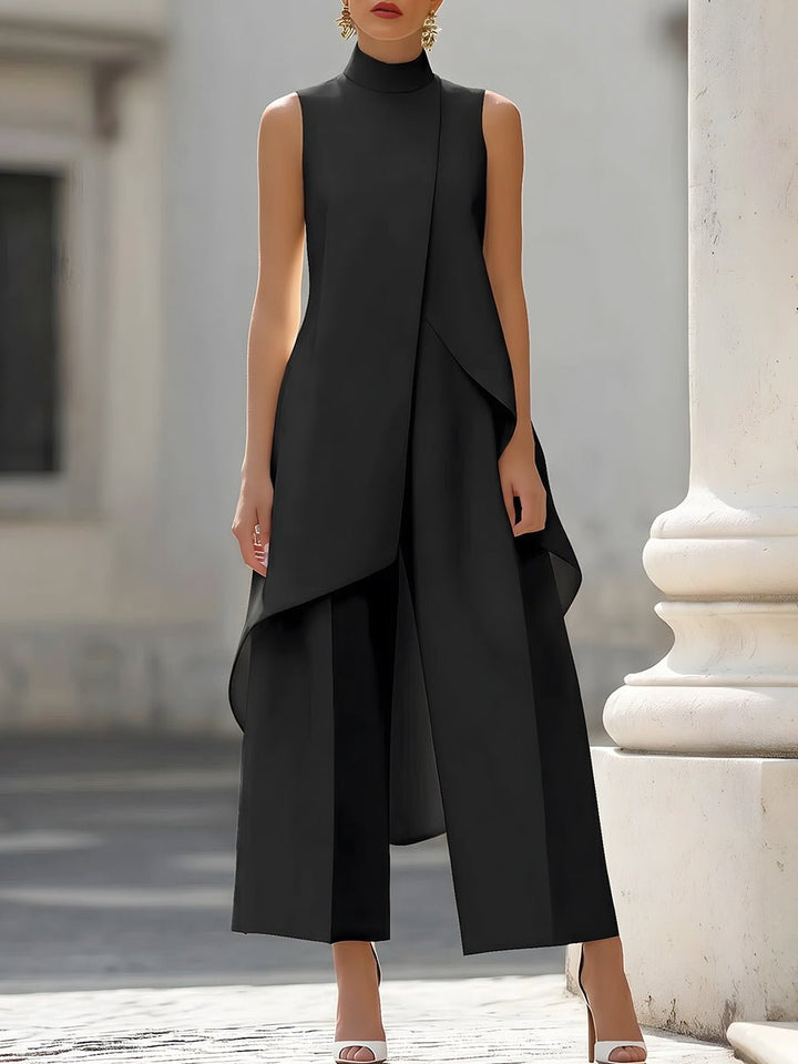 Formal women's sleeveless high-neck top with wide-leg trousers. Sophisticated two-piece suit for elegant office wear.
