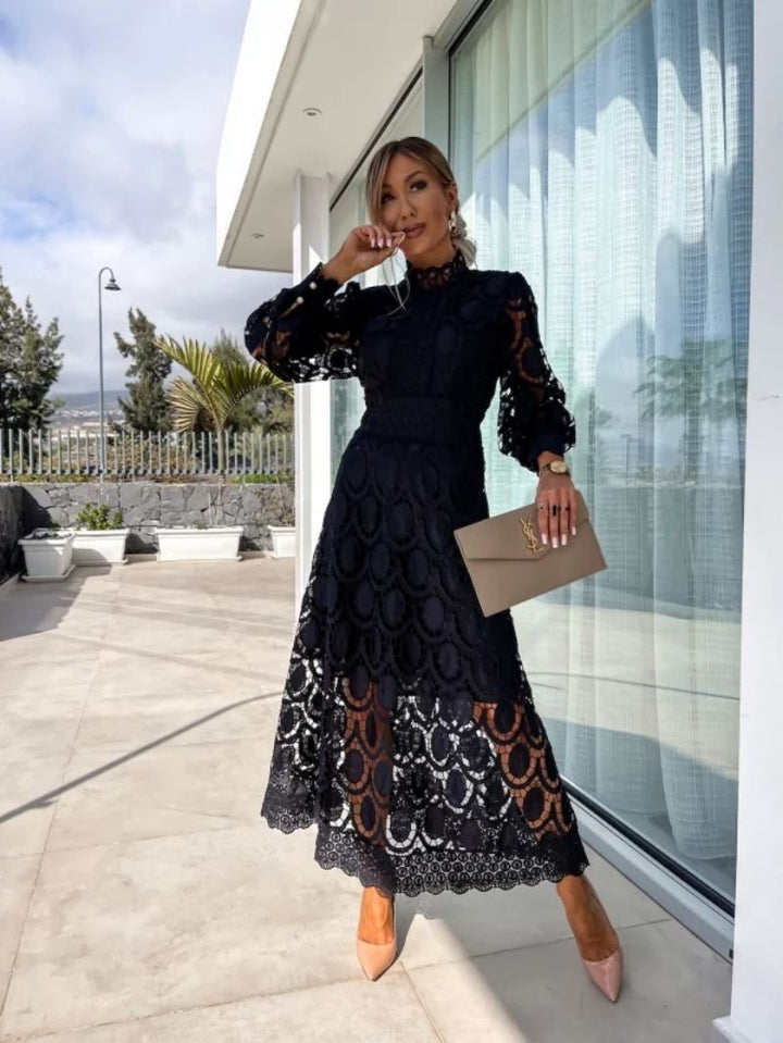 Feminine women's party dress with elegant high-neck, airy puff sleeves & lace details. Ideal for summer occasions.