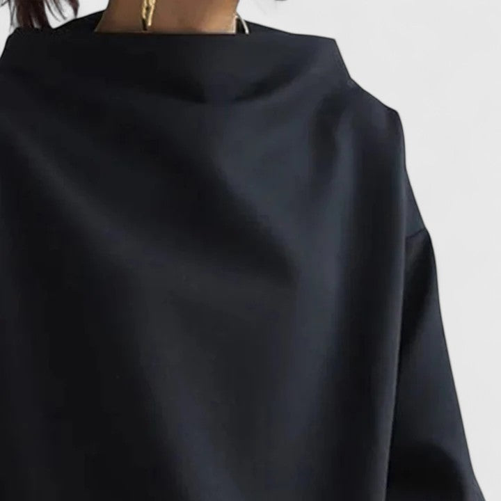 Modern women's elegant high-neck top. This versatile, long sleeve blouse offers a comfortable, chic, timeless style.