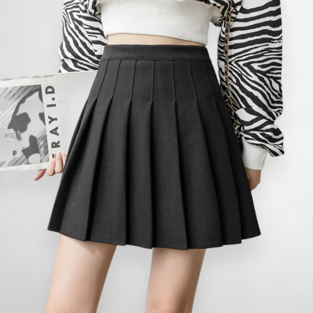 Women's pleated mini skirt with high waist, a versatile A-line design for modern fashion.