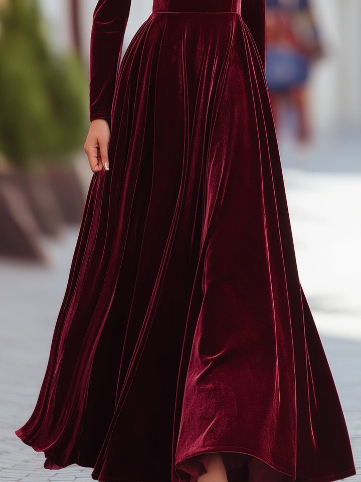 Formal dark green pleated longline dress for women, featuring a sophisticated mock neck and high waist.