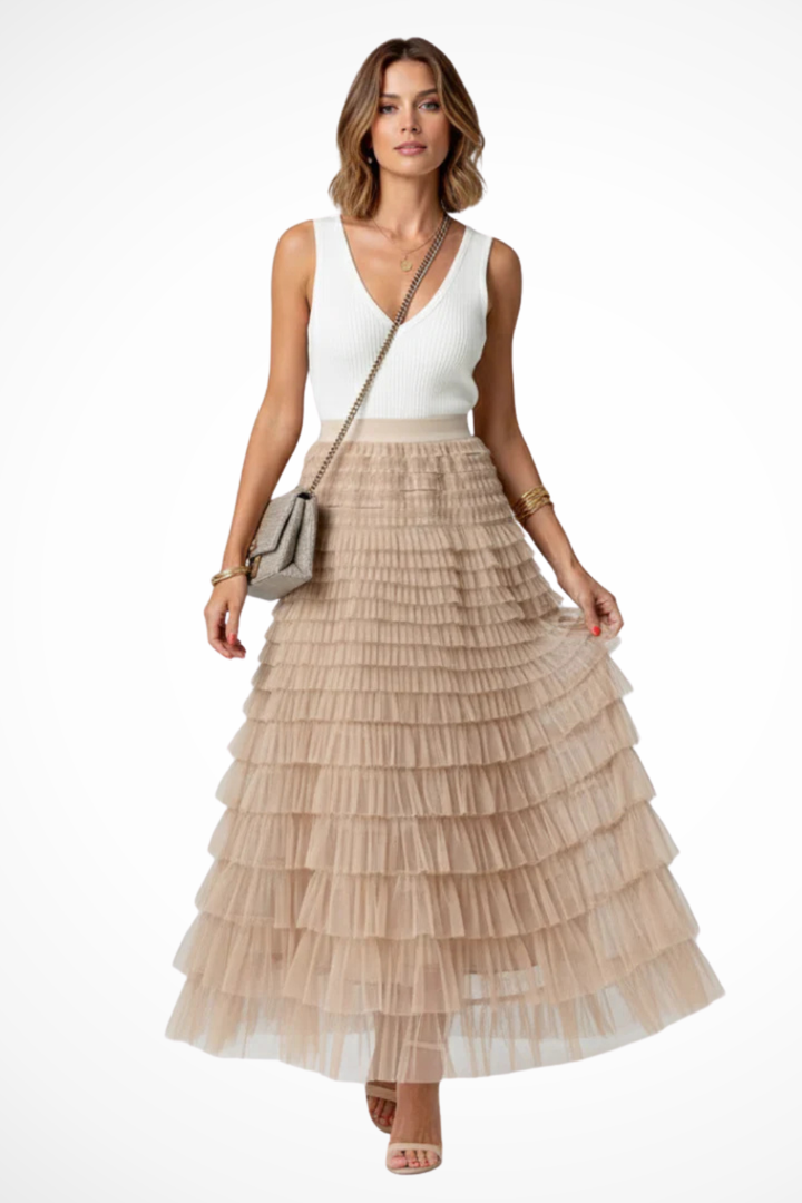 Elegant women's high-waist tiered midi skirt in beige, perfect for flowing chic style and spring fashion.