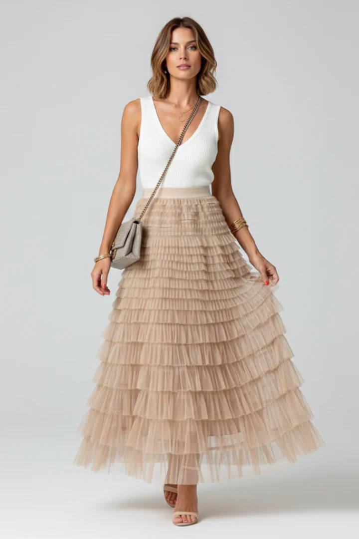 Chic black tiered midi skirt for women, high-waisted and flowing, versatile for summer or occasion wear.