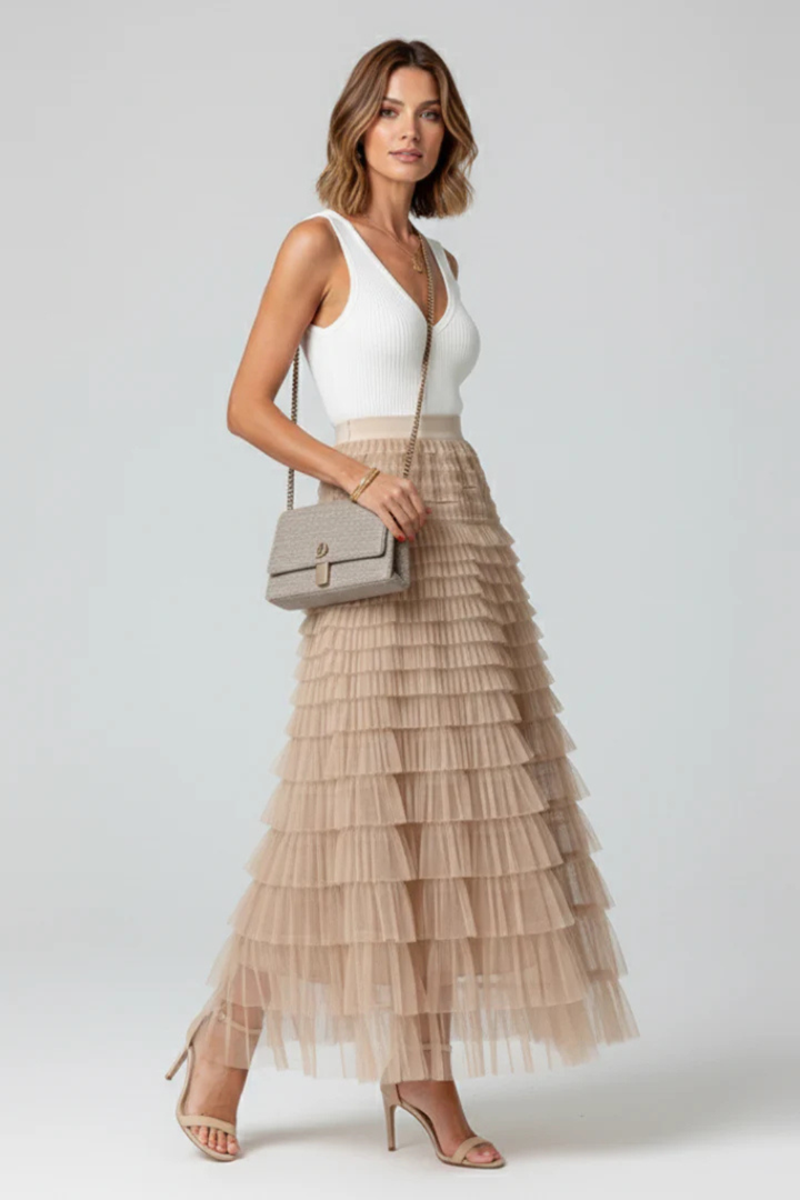 Beautiful black high-waist midi skirt for women with elegant tiers, offering a flowing style for any event.