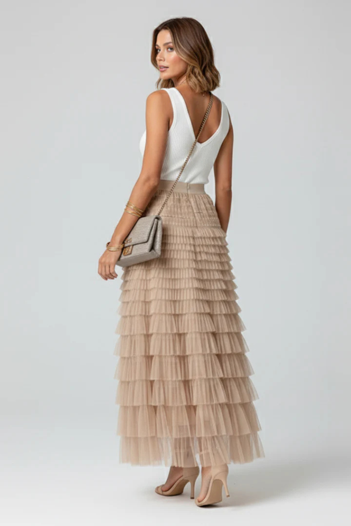 Versatile women's beige high-waist tiered midi skirt, chic flowing style for summer fashion & elegant looks.