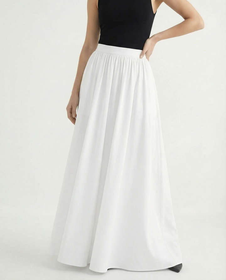 Trendy women's high-waisted flowing midi skirt, an elegant and versatile fashion statement for women.