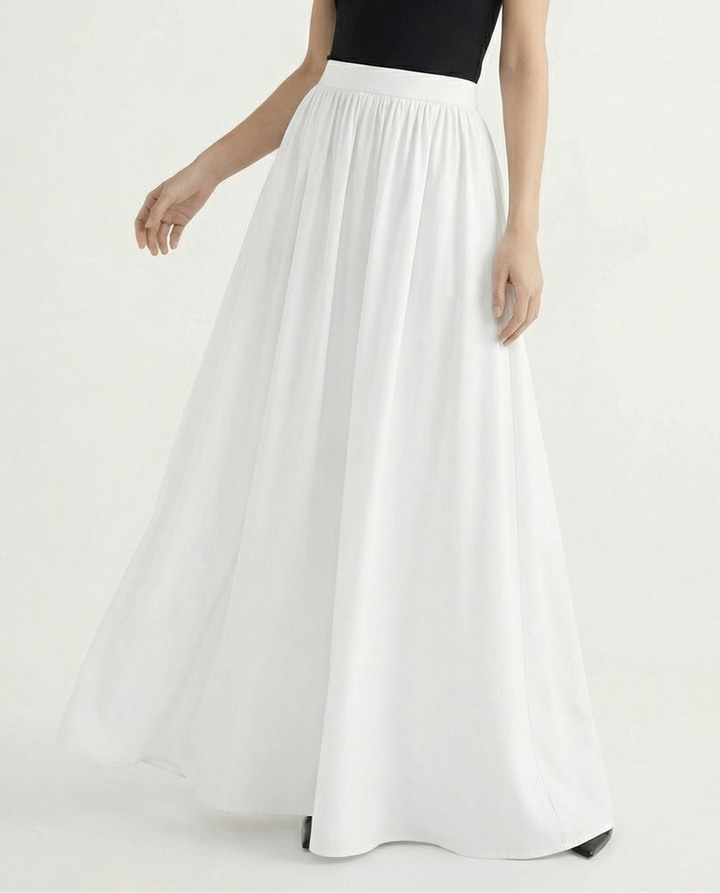 Flowy high-waisted midi skirt for women, elegant and versatile, moving beautifully with every step.