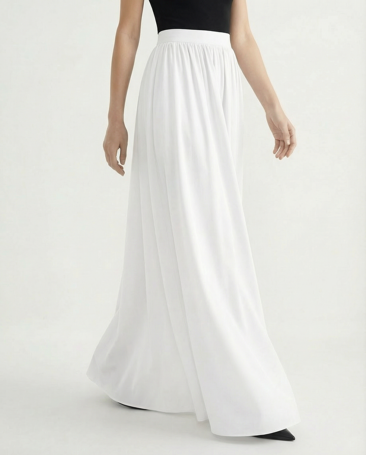 Adaptable women's high-waisted flowing skirt, elegant midi length perfect for day-to-night versatile styling.