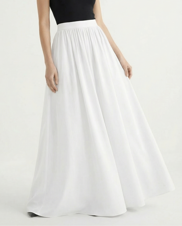 Graceful high-waisted flowing midi skirt for women, offering an elegant silhouette and versatile style.
