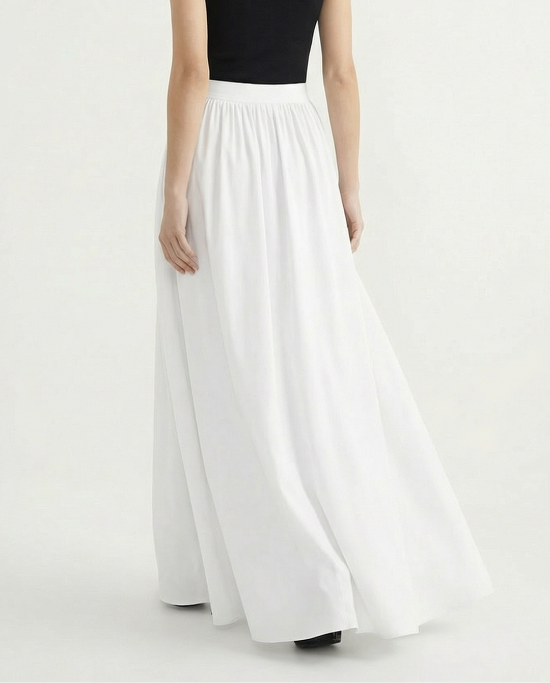 Stunning women's high-waisted flowing midi skirt, combining elegant design with versatile wearability.