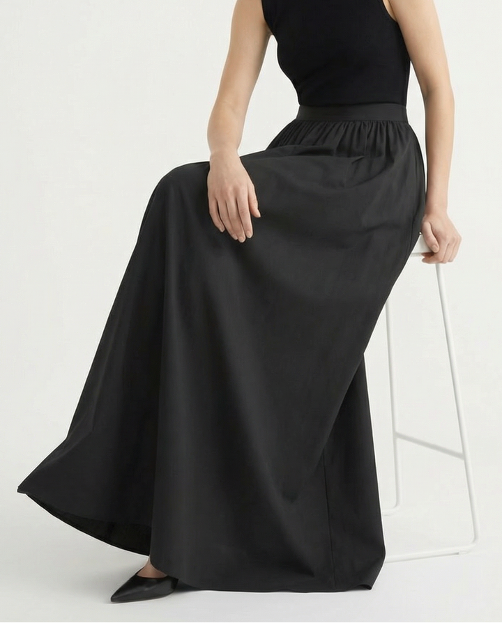 Longline flowing midi skirt for women, high-waisted and elegant, perfect for a chic & versatile look.