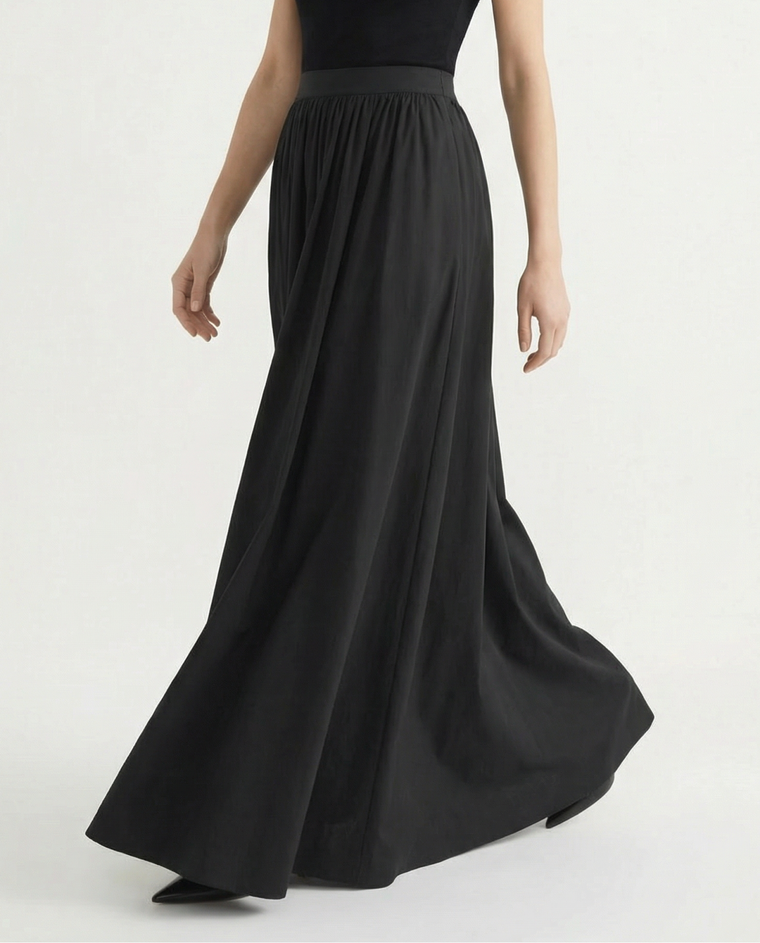 Casual chic women's high-waisted flowing midi skirt, offering versatile style for everyday elegance.