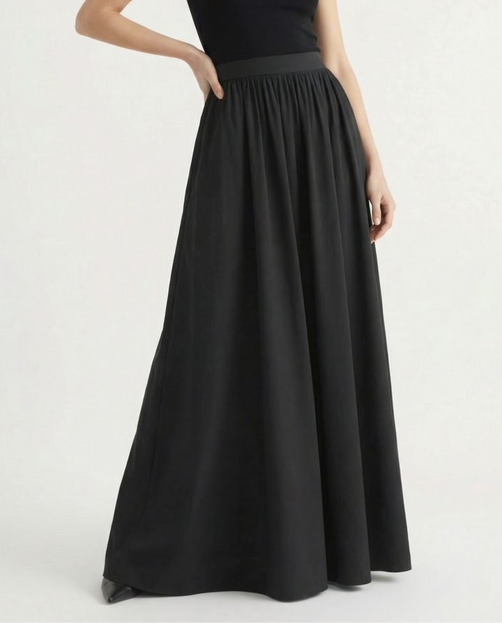 Elegant A-line high-waisted flowing skirt for women, a versatile midi length for sophisticated style.