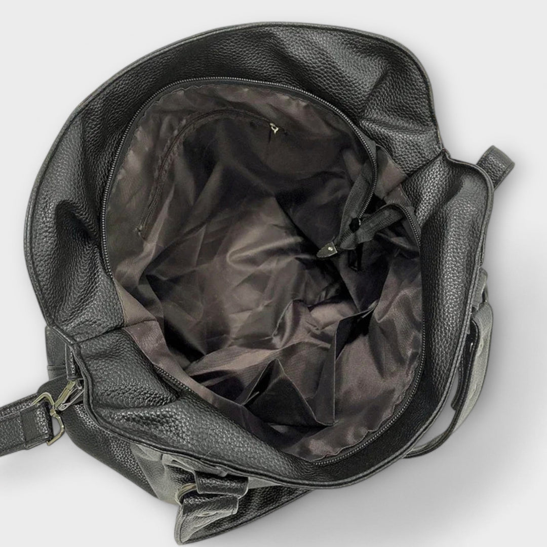 Elegant women's hobo shoulder bag, easily convertible to a crossbody or tote for versatility.