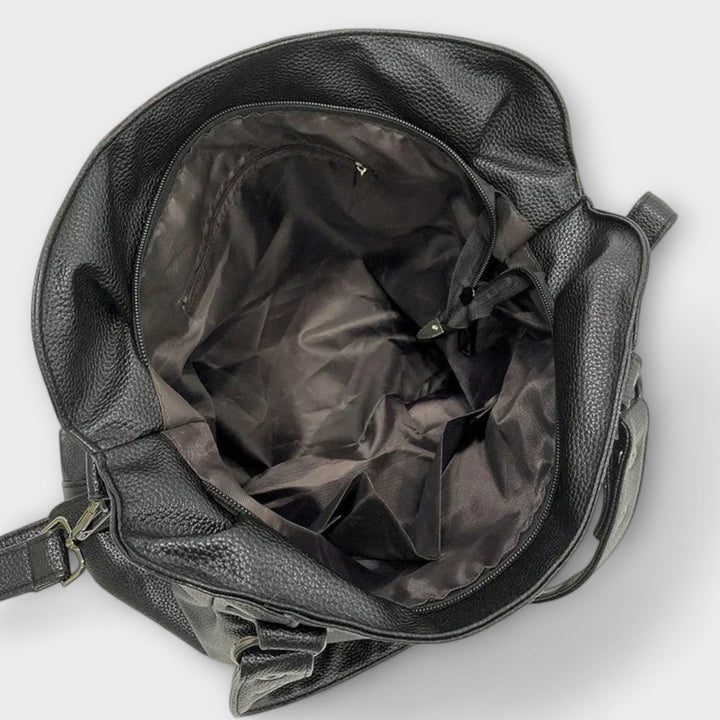Elegant women's hobo shoulder bag, easily convertible to a crossbody or tote for versatility.