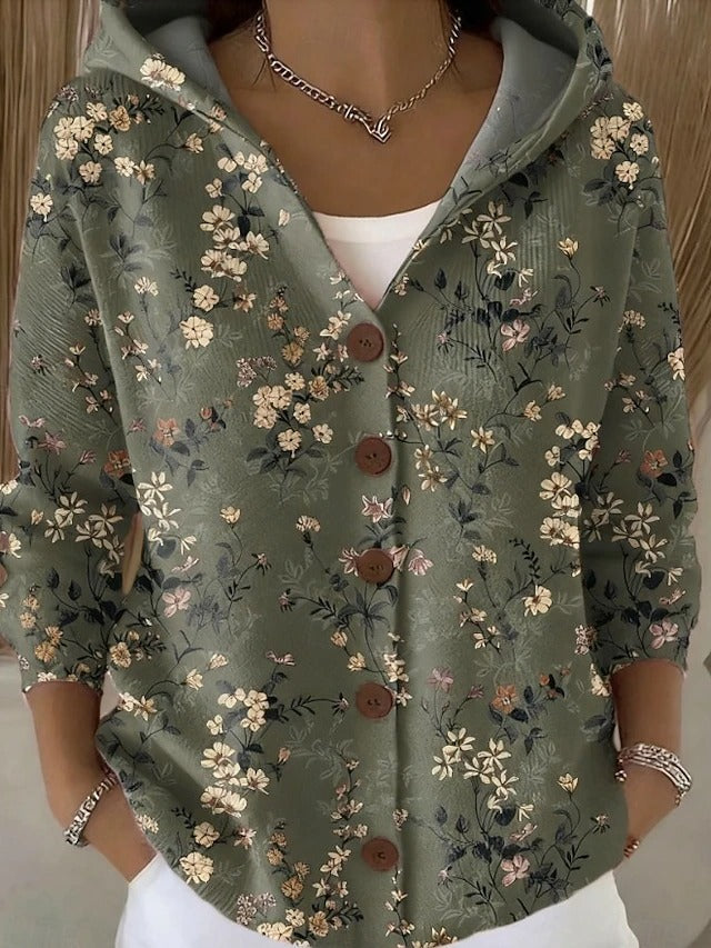 Detail shot: Elegant buttons on a cozy women's hooded knit sweater. Perfect for fall/winter, adding a stylish touch.