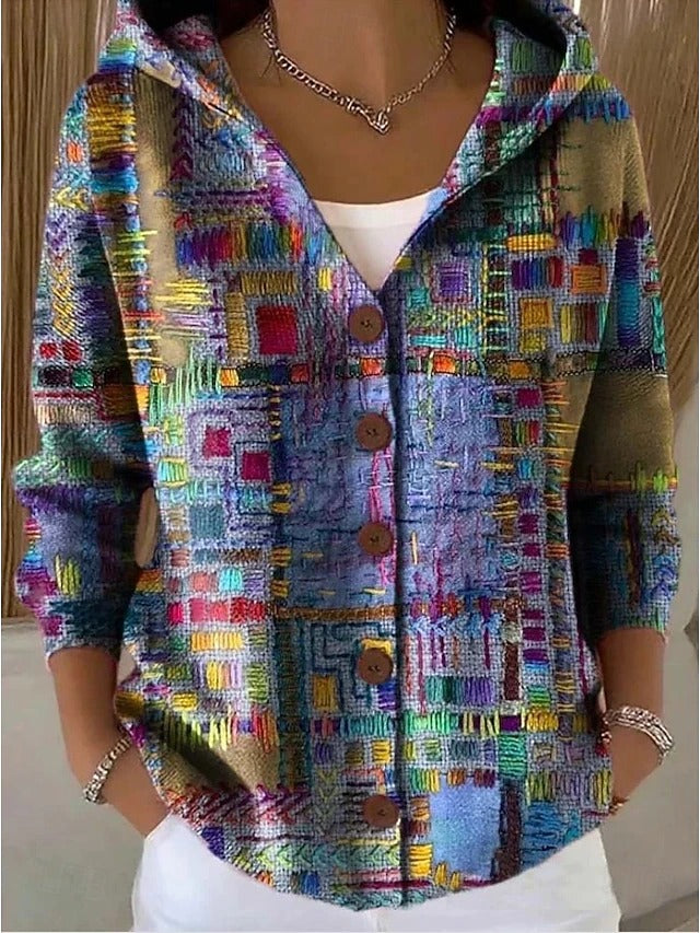 Elegant women's hooded jumper with decorative buttons, perfect for chic layering. Cozy knitwear for fall fashion.