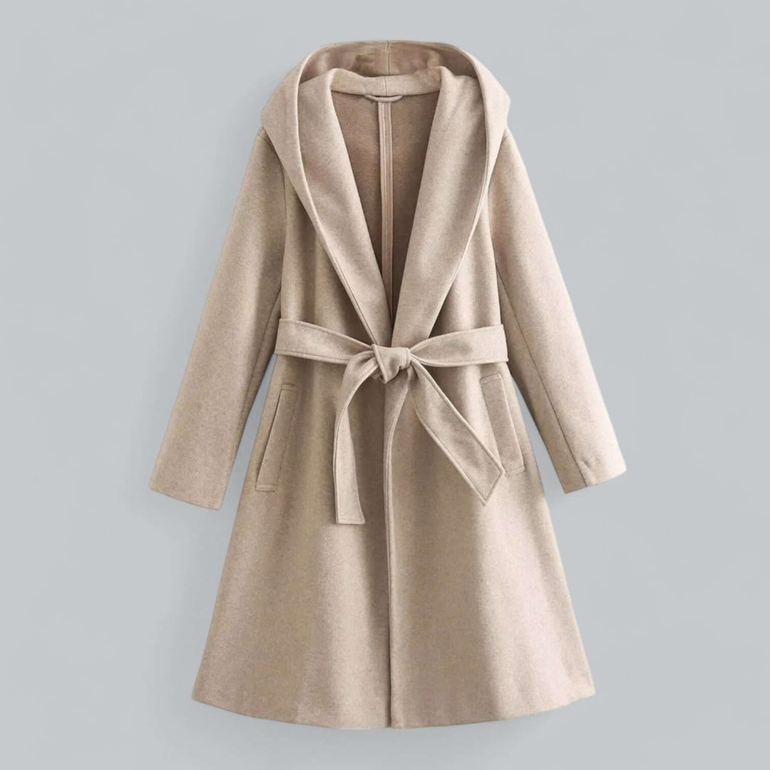 View of the back of a women's long hooded trench coat, highlighting its elegant cut and length.