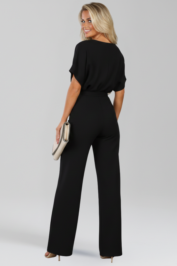 Chic wide-leg women's jumpsuit, ideal for professional or formal wear. Features an elegant tie waist.