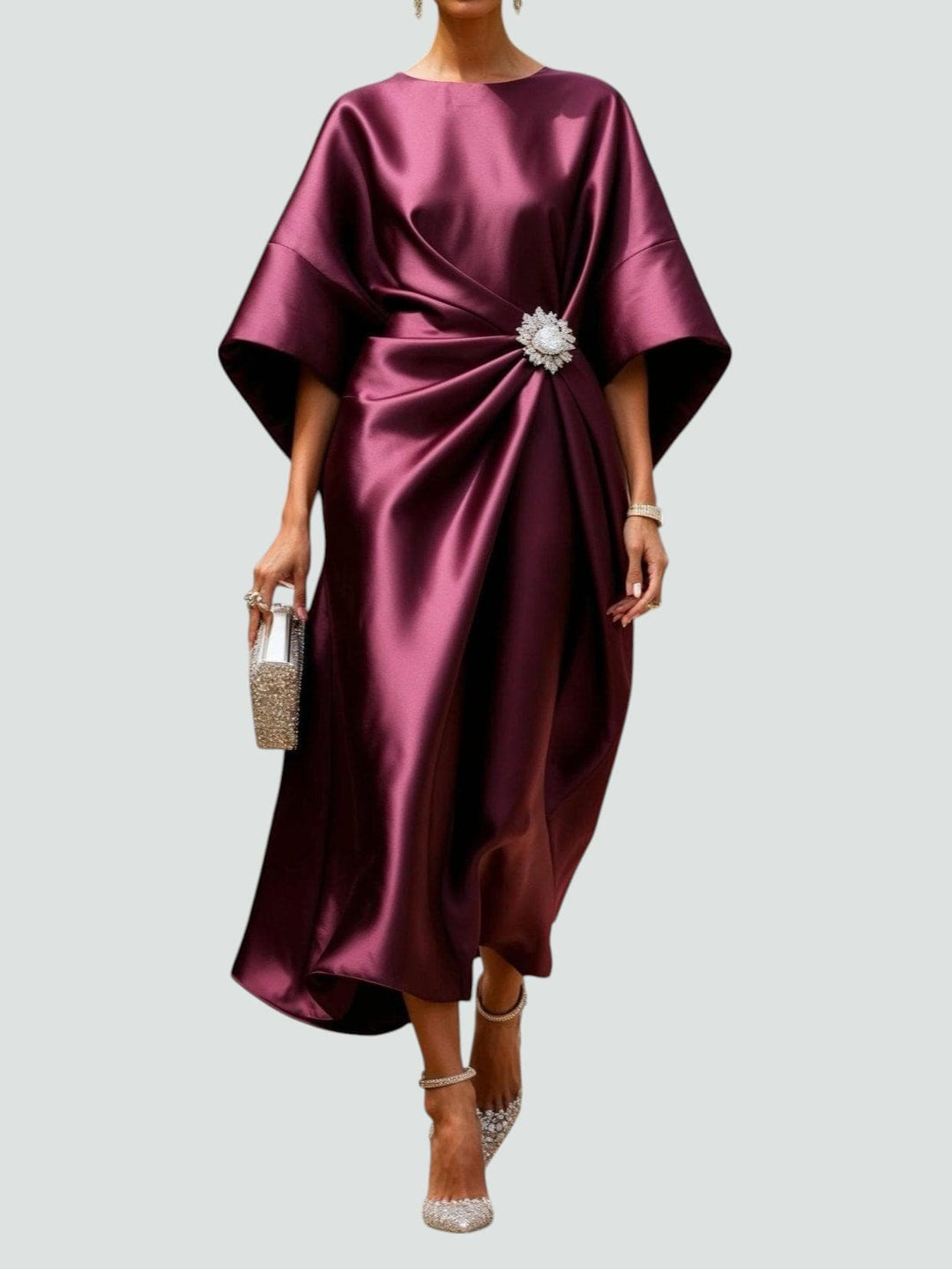 Flowy asymmetric hem midi dress for women, featuring elegant kimono sleeves and a chic crystal brooch.