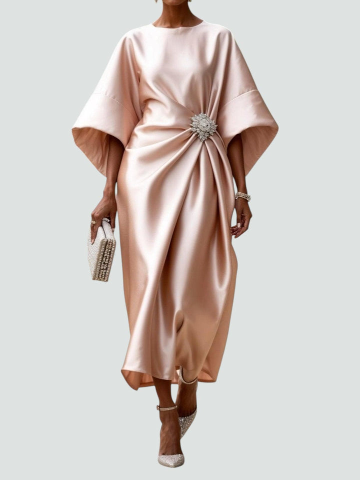 Chic women's midi dress featuring elegant kimono sleeves and an eye-catching crystal brooch, ideal for formal wear.