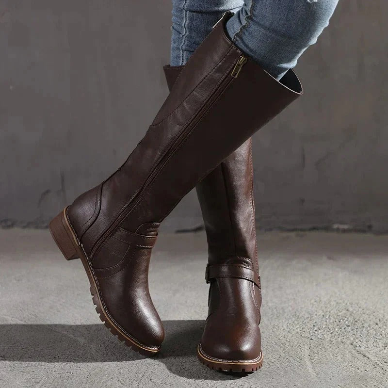 Elegant women's knee-high boots for chic fall & winter style. Classic fashion footwear, versatile tall design.