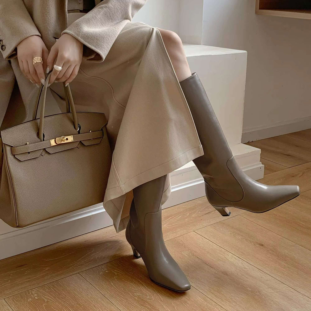 Classic women's knee-high boots, designed for timeless elegance and sophisticated style with a comfortable heel.