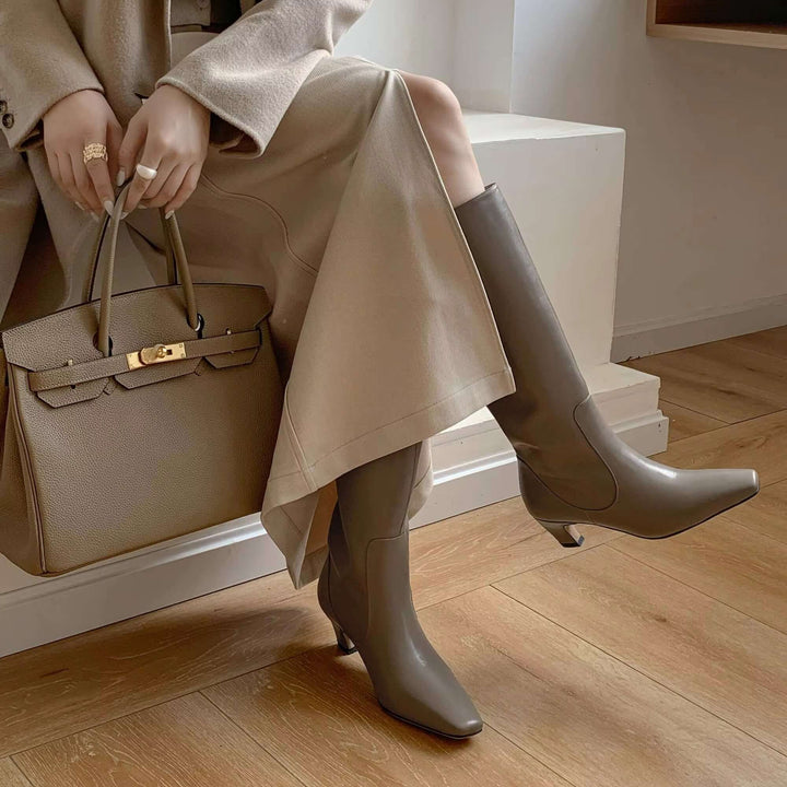 Classic women's knee-high boots, designed for timeless elegance and sophisticated style with a comfortable heel.