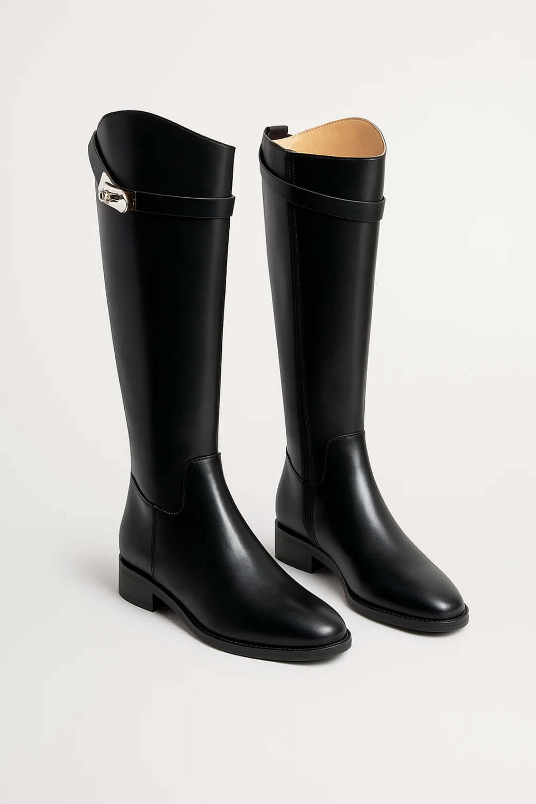 Elegant women's knee-high boots with buckle detail, perfect for classic autumn & winter fashion. Timeless tall ladies' footwear.