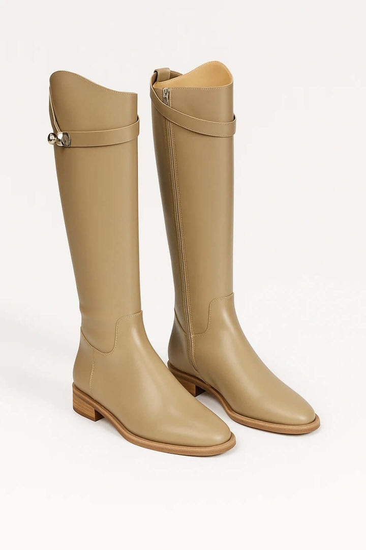 Versatile women's knee-high boots featuring a stylish buckle. Ideal for elegant autumn outfits & chic winter fashion.