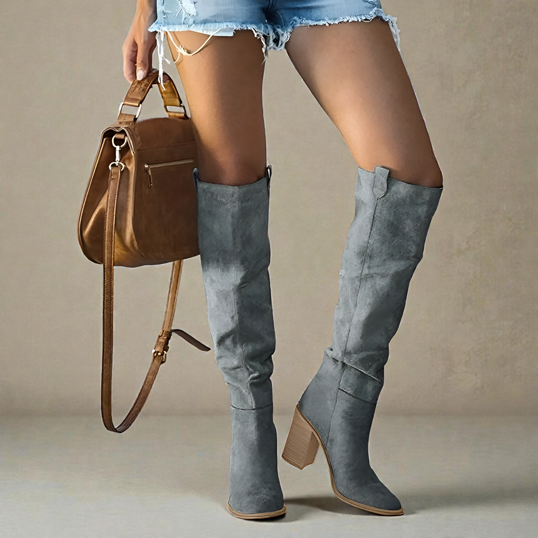 Elegant women's knee-high boots with sturdy block heels & closed toe, perfect for chic fall & winter fashion.