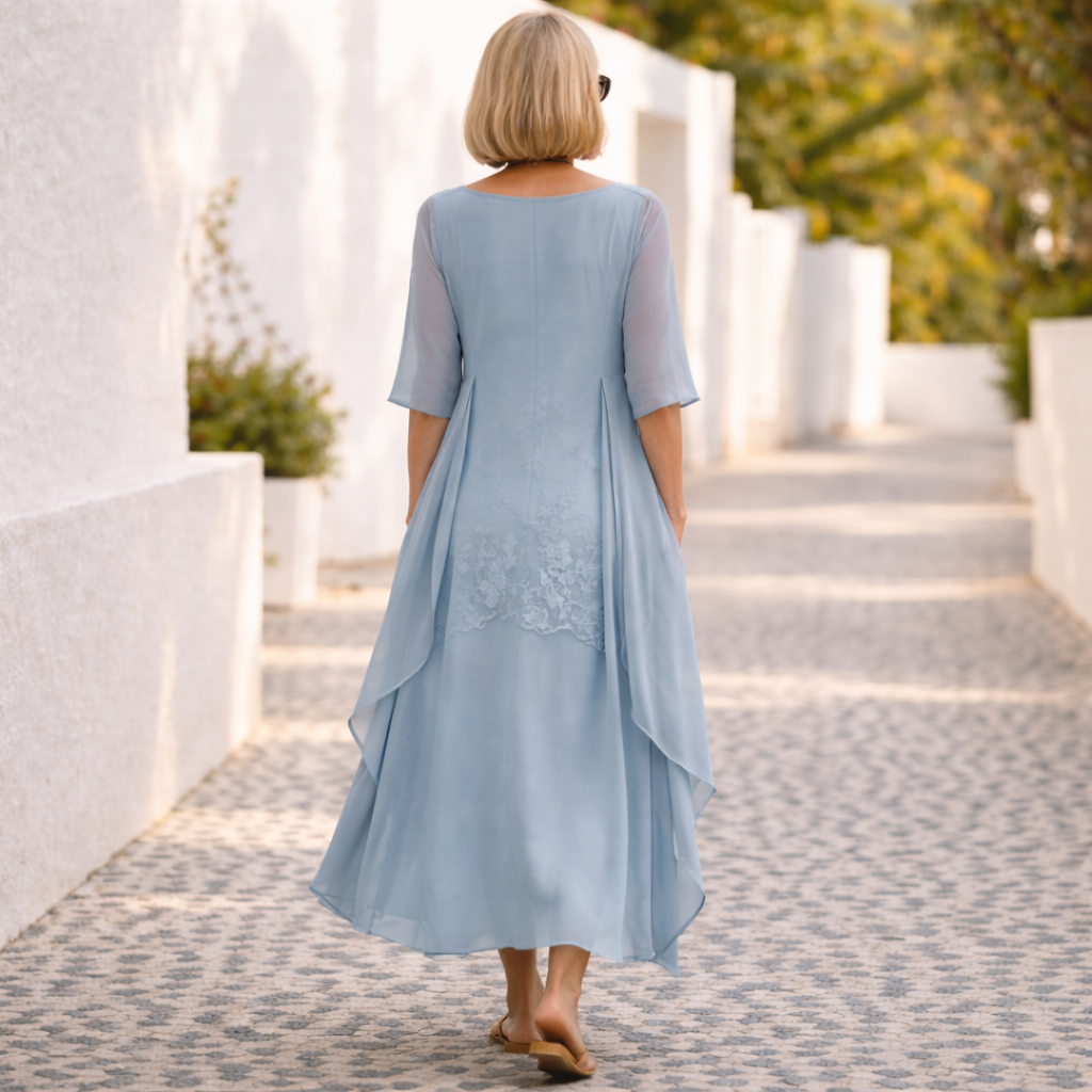 Stylish women's smocked patchwork dress. Flattering knee-length style for casual outings or elegant parties.