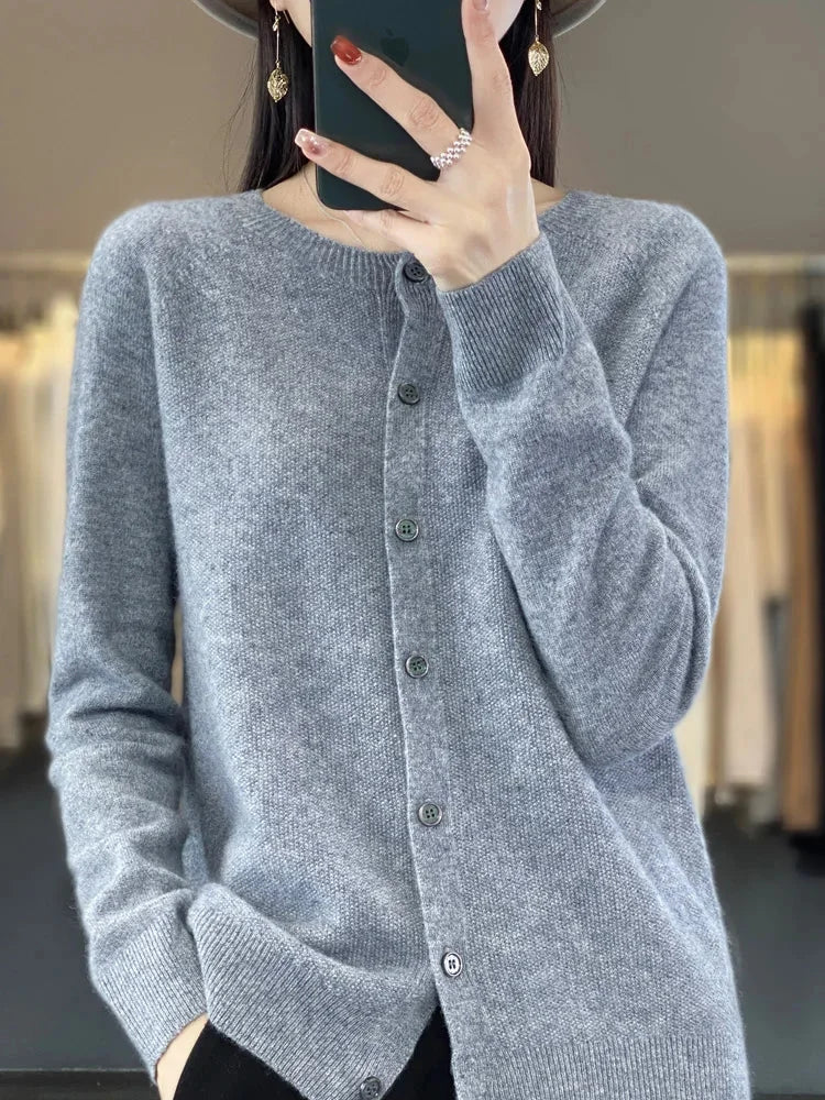 Versatile women's button-front knit cardigan, long sleeve, ideal layering piece for elegant casual wear and comfort.