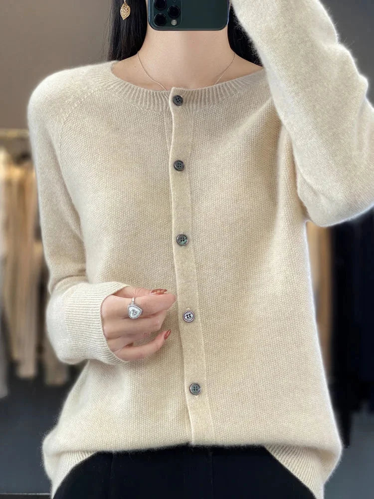 Women's crew neck knit cardigan sweater with elegant button front & long sleeves, offering soft comfort & versatile style.