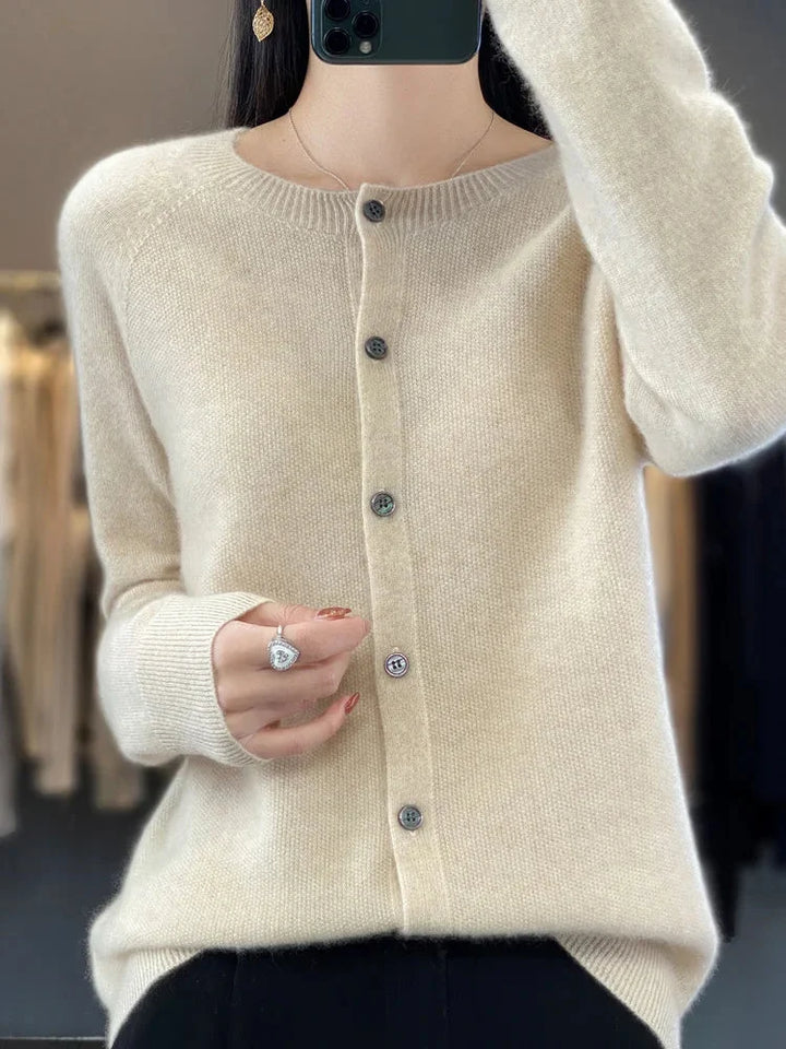 Women's crew neck knit cardigan sweater with elegant button front & long sleeves, offering soft comfort & versatile style.