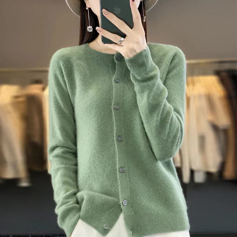 Women's elegant knit cardigan sweater, long sleeve, crew neck, and button front for versatile, comfortable layering.
